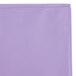 A close up of a Creative Converting Luscious Lavender purple plastic table cover in a bag with a zipper.