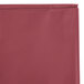 A burgundy plastic sheet with a white background.