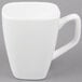 A close-up of a Libbey Ultra Bright White tall porcelain cup with a handle.