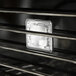 The side of a Blodgett electric convection oven with a glass square.