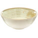 A white bowl with a brown speckled rim.