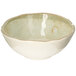 A white bowl with a green speckled rim.