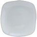 A white square Tuxton Artisan china plate with a small curved edge.