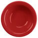 A red bowl with a white circular pattern.