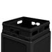 A black square plastic Commercial Zone waste container with a lid on top.