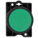 A green button with a black plastic frame.