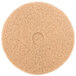 A 3M tan circular floor pad with a hole in the center.