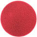 A red circular 3M floor pad.