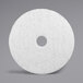 A white circular 3M Super Polishing floor pad