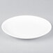 An Arcoroc Candour white porcelain B&B plate with a small rim.