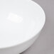 A white Arcoroc Candour porcelain bowl with a white rim.