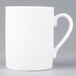 A white Arcoroc porcelain mug with a handle.