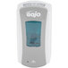 A GOJO® gray and white touchless hand soap dispenser.