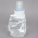 A close-up of a Purell foaming hand sanitizer bottle with a white cap.