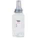 A clear plastic bottle of GOJO clear & mild foaming hand soap with a silver lid.
