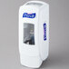 A white Purell hand sanitizer dispenser with a clear window.