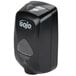 A black GOJO® touchless soap dispenser with a clear plastic lid.
