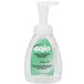 A close-up of a GOJO Green Certified foaming hand soap pump bottle with a green label.