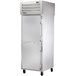 A True pass-through freezer with a white door and silver handle.