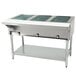 A large stainless steel Eagle Group hot food table with an open well holding three trays.