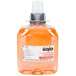 A bottle of GOJO® orange blossom foaming hand soap with a white label and a grey cap.