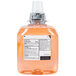 A white labeled bottle of GOJO Orange Blossom foaming antibacterial hand soap.