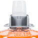 A close-up of a GOJO plastic bottle of orange liquid with a plastic cap. 