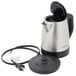 A Hamilton Beach stainless steel kettle with a cord attached.