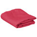 A folded hot pink cloth table cover.