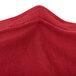 A close up of a crimson Snap Drape contour table cover.