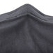 A charcoal Snap Drape spandex table cover with a zipper on the back.