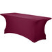 A burgundy Snap Drape spandex table cover on a table.