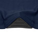 A navy blue spandex table cover with a black triangle design.