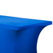A royal blue Snap Drape Contour Table Cover on a table with curved edges.