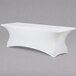 A white rectangular Snap Drape spandex table cover with curved edges.