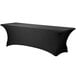 A black Snap Drape Contour table cover with a curved edge on a rectangular table.