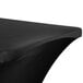 A black Snap Drape Contour Table Cover on a table with a curved edge.
