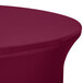 A burgundy Snap Drape Contour spandex table cover on a round table.