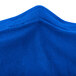 A close up of a royal blue spandex Snap Drape table cover.
