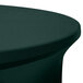 A hunter green Snap Drape spandex table cover on a round table.