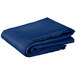 A folded royal blue Intedge square table cover.
