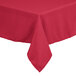 A hot pink rectangular hemmed cloth table cover on a table.