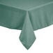 A close-up of a seafoam green rectangular tablecloth on a table.