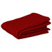 A stack of red folded Intedge round table covers on a white background.