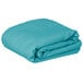 A teal rectangular Intedge cloth table cover folded on a white background.