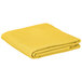 A yellow table cover folded on a white background.