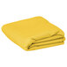 A yellow rectangular Intedge table cover folded on a white background.