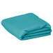 A folded teal blue Intedge rectangular table cover.