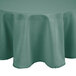 An Intedge seafoam green round tablecloth on a round table.