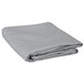 A folded grey 100% polyester table cover.